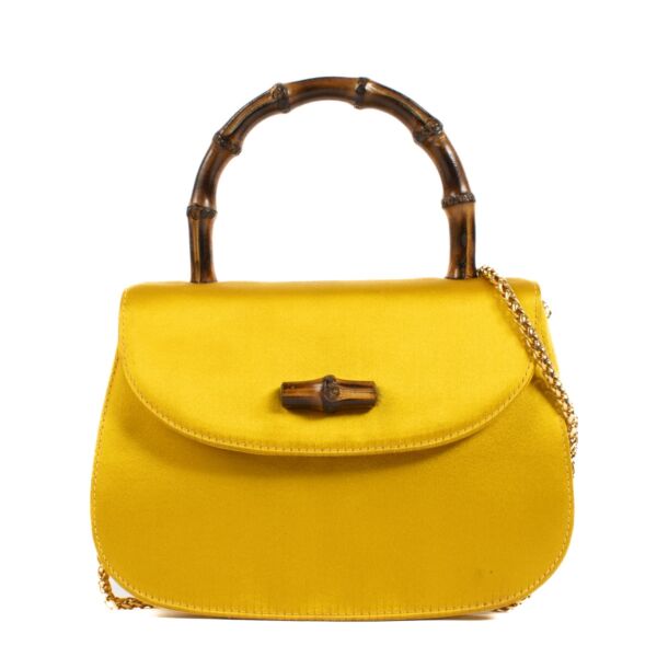 Shop safe online at Labellov in Antwerp, Brussels and Knokke this 100% authentic second hand gucci Yellow Satin Bamboo night satchel Top Handle Bag