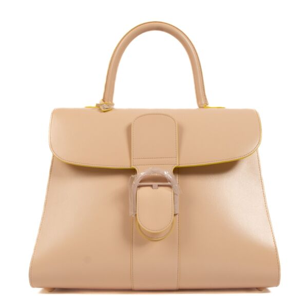 Buy an authentic second hand Delvaux Lilas/Ivory Box Calf Brillant GM Biface in new condition at Labellov. 