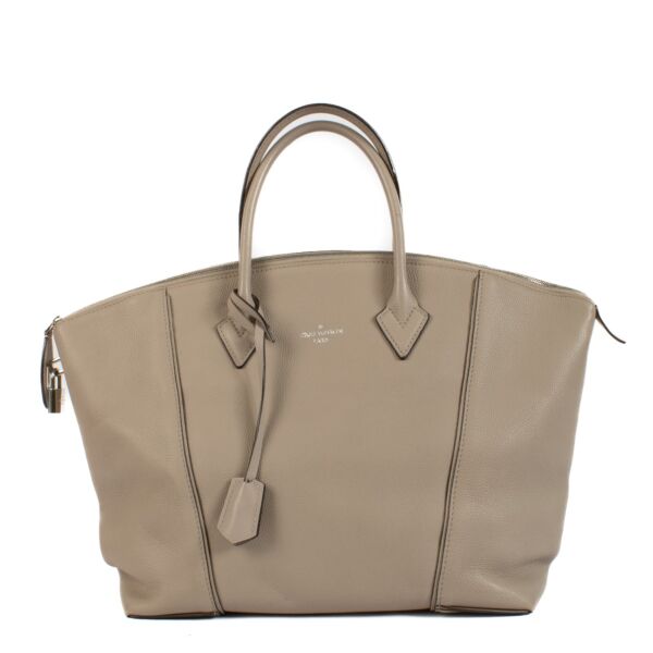 Shop 100% authentic Louis Vuitton Galet Veau Cashemire Soft Lockit MM Top Handle Bag at Labellov.com.